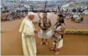  ?? L’OSSERVATOR­E ROMANO VATICAN MEDIA VIA ASSOCIATED PRESS ?? Pope Francis arrives Friday in a coliseum in Puerto Maldonado, Peru, the city considered a gateway to the Amazon.