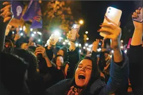  ?? (AP) ?? Women shout slogans as they gather to mark Internatio­nal Women’s Day in Istanbul, Turkey, March 8, 2023.