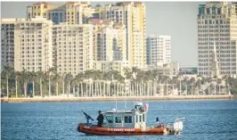  ?? BRUCE R. BENNETT/PALM BEACH POST ?? The West Palm Beach skyline is seen in the distance in 2017. A bond issue could give $200 million to developers to build affordable housing, but where the housing would be built and how developers would get the money is in question.