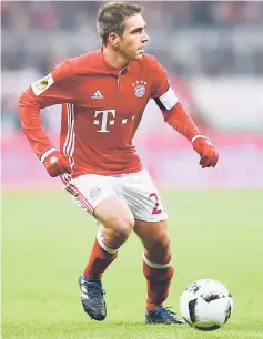  ??  ?? Lahm plays the ball during the German Cup DFB Pokal Round of 16 football match FC Bayern Munich v VFL Wolfburg in Munich, southern Germany. — AFP photo