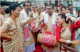  ?? — PTI ?? Assam DGP Mukesh Sahay beats a dhol during the Bohagi Utsav 2017 at Ulubari in Guwahati on Thursday.