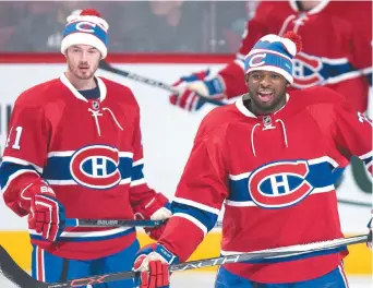  ?? Canadienne: Paul Chiasson
- La Presse ?? Le défenseur du Canadien de Montréal, P.K. Subban (à droite), et son coéquipier Paul Byron ont porté la tuque promotionn­elle de l’équipe en vue de la Classique hivernale du 1er janvier face aux Bruins de Boston au Gillette Stadium de Foxboro.