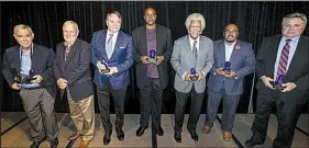  ?? Arkansas Democrat-Gazette/MITCHELL PE MASILUN ?? The inaugural class of the OneRock Legends Hall of Fame was inducted Wednesday in Little Rock. Pictured are (from left) Charles Ripley, keynote speaker Harold Horton, Houston Nutt, Sidney Moncrief, Oliver Elders, Darrell Brown (accepting for DeeDee Brown-Campbell) and Bruce Matthews (accepting for Wilson Matthews).