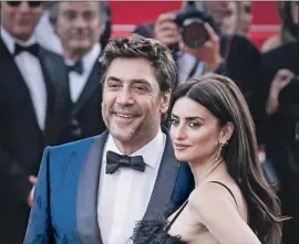  ?? Tristan Fewings Getty Images ?? JAVIER BARDEM and Penelope Cruz, spouses and costars of the Cannes opening-night film “Everybody Knows,” walk the red carpet on Tuesday.