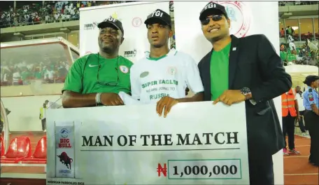  ??  ?? L-R: Executive Director, TGI Group, Mr. Onyekachi Onubogu; Super Eagles defender, Shehu Abdullahi, winner of The Big Bull Rice Man-of-the-Match Award; and the Chief Financial Officer of WACOT Limited, Mr. Sumit Jain, during the presentati­on of the...