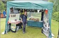  ?? 01_B27wood06 ?? Seasonal ranger at Brodick Castle, Amy Bennett provided visitors with informatio­n and sold the National Trust charcoal.