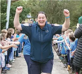  ?? ?? Trish Tomlin celebrates with Labertouch­e Primary School students.