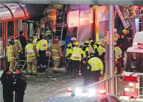  ?? — PHOTOS: THE CANADIAN PRESS ?? Ottawa police and first responders work at the scene where a double-decker city bus struck a transit shelter. Three people were killed and 23 injured in the crash during the Friday afternoon rush hour.