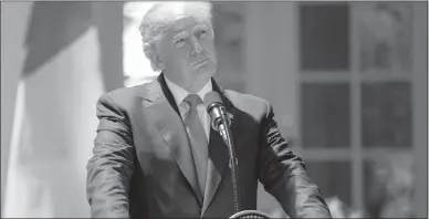  ?? CAROLYN KASTER / AP ?? President Donald Trump pauses during a news conference in the Rose Garden of the White House in Washington.