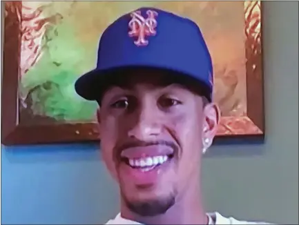  ?? NEW YORK METS VIA THE ASSOCIATED PRESS ?? This screen grab from a Zoom call on Monday, Jan. 11, shows Francisco Lindor smiling while wearing a Mets hat.