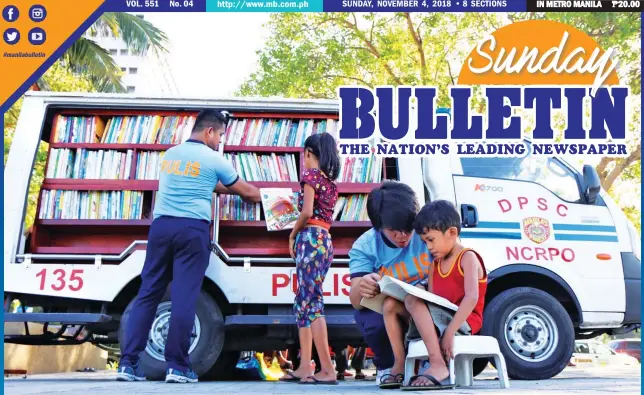  ??  ?? BOOK 'EM — Police officers of the Manila Police District Mobile Force interacts with street kids during the launch of 'Ang Guro Kong Pulis' mobile library at Manila Bay. (Ali Vicoy)