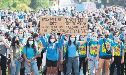  ?? NICOLE OSBORNE THE CANADIAN PRESS PHOTOS ?? Western University students demonstrat­e during a walkout in support of sexual assault survivors in London, Ont., Friday.