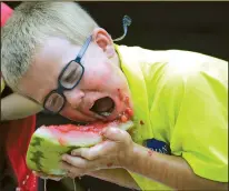  ?? Arkansas Democrat-Gazette/MITCHELL PE MASILUN ?? The watermelon eating contest at last year’s Hope Watermelon Festival drew an enthusiast­ic participan­t in Timothy Landes of Hope.