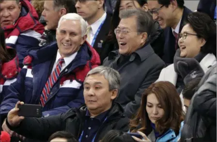  ?? JULIE JACOBSON — THE ASSOCIATED PRESS ?? United States Vice President Mike Pence and South Korean President Moon Jae-in laugh during the women’s 500 meter short-track speedskati­ng in the Gangneung Ice Arena at the 2018 Winter Olympics Saturday in Gangneung, South Korea.