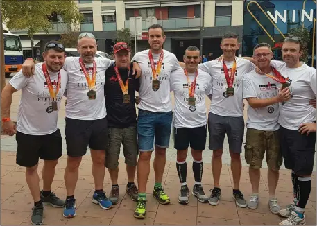  ?? Photo: Debbie Byrne ?? Members of Tinahely Tri-Club who completed the Ironman Challenge in Barcelona recently. From left: Darren Mooney, Jim Dunne, Alan Byrne, Merridan Davis, Johnny Dempsey, Damien Tracey, Jason O’Neill and Ray Caulfield.