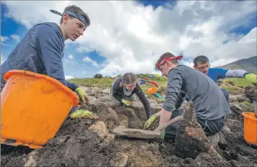  ??  ?? Main picture: Peter Devlin; picture left: Rare Breed Production­s Archaeolog­ists carefully expose the secrets of Dun Deardail, which revealed a cross-section of vitrified rocks from the Glen Nevis excavation.