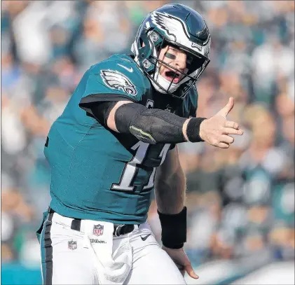  ?? AP PHOTO ?? Philadelph­ia Eagles’ Carson Wentz reacts after running for a first down during an NFL game against the Chicago Bears on Sunday in Philadelph­ia.