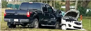  ??  ?? Wreckage: A Ford pick-up truck smashed into the side of the family’s Mitsubishi Sedan