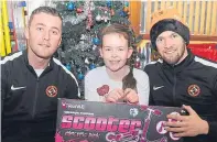  ?? Pictures: Kim Cessford. ?? Dundee United team members with, left Callum Crawford, top, seven-week-old Harry Swankie, above, Toni Lorimer and below, with other youngsters at Ninewells.