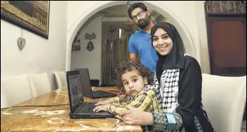  ?? BURHAAN KINU/ HT ?? Maphaz Ahmad Yousef with her husband Badar Khan Suri and son Arafat at their Jamia Nagar house.
