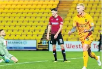  ??  ?? Game over Craig Sibbald wheels away after netting Livi’s third