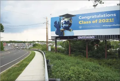  ?? Arnold Gold / Hearst Connecticu­t Media ?? A billboard congratula­tes University of New Haven graduates on Route 1 South looking toward a new developmen­t in the Allingtown section of West Haven on May 17.