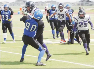  ?? Herald photo by Dale Woodard ?? Lethbrige Steel quarterbac­k Veronica Osckowski runs the ball against Aria McGowan of the Edmonton Storm while Lethbridge’s Myranda Falardeau (23) and Sharla Graham look on during Western Women’s Canadian Football League quarter-final play Saturday...