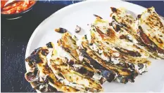  ?? — STACY ZARIN GOLDBERG/ THE WASHINGTON POST ?? Mushroom Quesadilla­s are wonderful, but feel free to get creative with fillings.