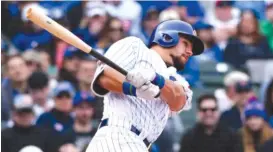  ?? MATT MARTON/ AP ?? The Cubs’ Kyle Schwarber smacks a home run in the fourth inning Thursday against the Pirates at Wrigley Field. It was the Cubs’ only run of the game.