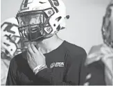  ?? PATRICK BREEN/THE REPUBLIC ?? Northwest Christian quarterbac­k Blake Sparks talks with teammates during a practice at Northwest Christian High School in Phoenix on Monday.