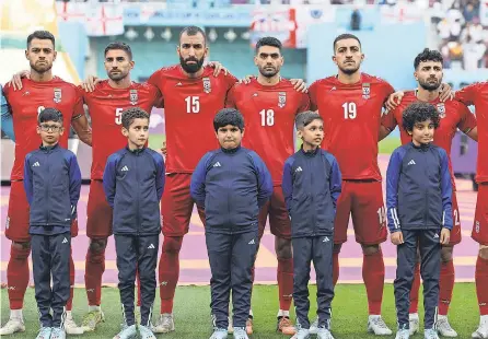  ?? FADEL SENNA/ AFP VIA GETTY IMAGES ?? The Iranian players’ silence during their country’s national anthem spoke volumes Monday.