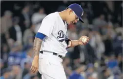  ?? Victor Decolongon Getty Images ?? JULIO URIAS is seen after giving up a hit during a Dodgers game May 9. He had a 1.06 ERA in his first three starts, but was pounded in his last two.