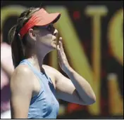  ?? Associated Press ?? KISSES Russia’s Maria Sharapova celebrates after defeating Britain’s Harriet Dart during their first round match at the Australian Open in Melbourne, Australia, on Sunday.