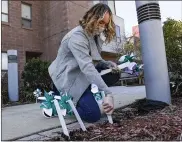  ??  ?? Angie Gilmour, a bilingual counselor at Safe Berks, helps to put out pinwheels at Safe Berks in Reading Friday afternoon April 2, 2021. The staff members put out 250 pinwheels to symbolize local victims of sexual assault as part of their event, “Recognizin­g & Rememberin­g Victims of Sexual Assault – Known & Unknown,” during Sexual Assault Awareness Month.