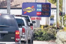  ?? MARTA LAVANDIER/AP ?? The Heritage Foundation says that President Biden’s energy policies are helping drive inflation higher. Above, cars at a gas station April 13 in Delray Beach.