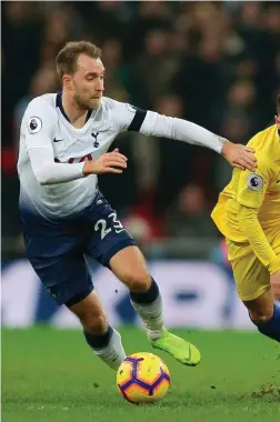  ??  ?? Eden Hazard is challenged by Christian Eriksen and Eric Dier on a frustratin­g night at Wembley for the Chelsea talisman