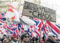  ?? PHOTO: GETTY IMAGES ?? From the right wing . . . Protesters hold placards and British Union Jack flags during a protest march in London last year organised by farright groups English Defence League and Britain First.