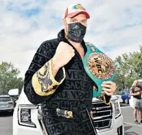  ?? ?? Masked marauder: Tyson Fury shows off the belt he will be defending against Deontay Wilder in Las Vegas on Saturday night