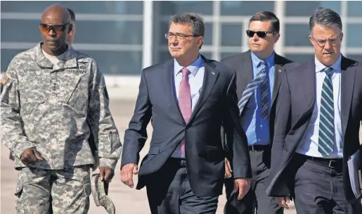  ?? 2015 PHOTO BY CAROLYN KASTER, AP ?? Ron Lewis, left, was a top aide to Defense Secretary Ash Carter, center.