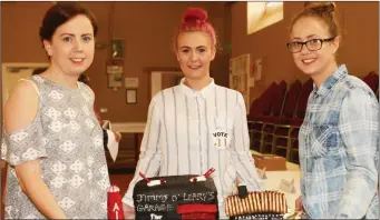  ??  ?? Emma, Lorraine and Linda O’Leary, who made a cake of their grandfathe­r Jimmy O’Leary’s historic garage in Fethard-on-Sea. Their efforts saw them win the ‘People’s Choice’ category.