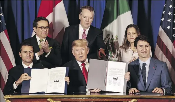  ?? SARAH PABST/BLOOMBERG ?? From front left foreground, Mexican President Enrique Peña Nieto, U.S. President Donald Trump and Prime Minister Justin Trudeau signed the United States-Mexico-Canada Agreement at the G20 Summit in Buenos Aires on Friday.