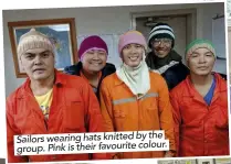  ??  ?? Sailors wearing hats knitted by the group. Pink is their favourite colour.