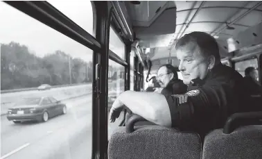  ?? STAFF PHOTO BY C.B. SCHMELTER ?? Chattanoog­a Police Department Sgt. Gary Martin monitors drivers from aboard the bus Wednesday