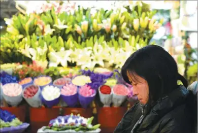  ?? PROVIDED TO CHINA DAILY ?? An increase in the price of flowers has affected business at a market in Hangzhou, Zhejiang province. Unusually cold weather this winter in Yunnan province has caused a spike in the cost of flowers in many cities.