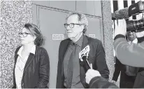  ?? PHOTO BY DEAN LEWINS/AAP IMAGE VIA AP ?? Australian actor Geoffrey Rush, center, leaves the Federal Court in Sydney, Australia, on Monday. The actor faced a large media pack as he entered Sydney’s Federal Court, where a judge is hearing his defamation trial against Sydney’s Daily Telegraph and its journalist Jonathon Moran.