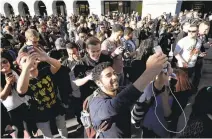  ?? MARCIO JOSE SANCHEZ/ASSOCIATED PRESS ARCHIVES ?? “Pokémon Go” players begin a group walk along San Francisco’s Embarcader­o in July. The app was an instant hit when it debuted in July.