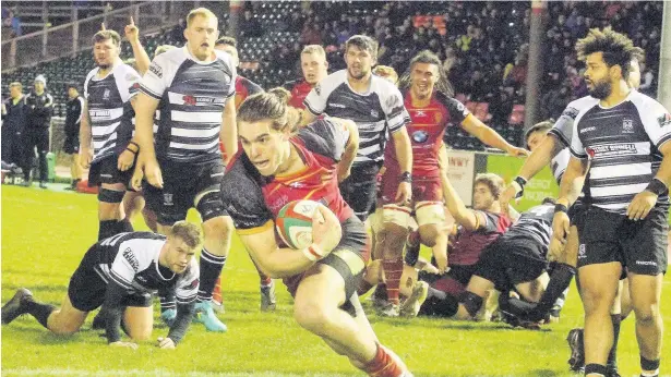  ??  ?? RGC’s right wing Karl Martin adds a try against Cross Keys with a move that left everyone standing still.