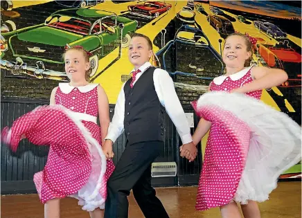  ?? JOHN HAWKINS/STUFF ?? Rock’n’rollers Megan Phillipson, 9, Hunter Harris, 10, and Briarlee Devery, 10, danced their way into the medals at the 2018 Junior Nationals Competitio­n in Auckland.