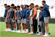  ?? AP ?? Ajit Wadekar in 2011 and, above, Indian players and coaching staff observe a minute’s silence for Wadekar before the third test against England in Nottingham last month.