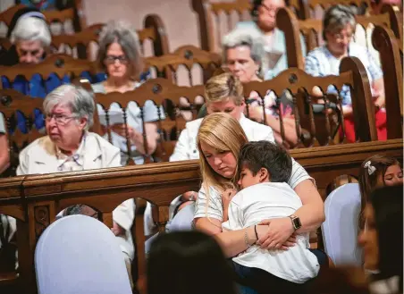  ?? Annie Mulligan / Contributo­r ?? Paige Ingersoll holds her 6-year-old nephew, Dante Villanueva, during the World Day of Prayer for the Care of Creation event on Sept. 7 in Houston. Local faith leaders gathered to address ecological crisis and climate change.